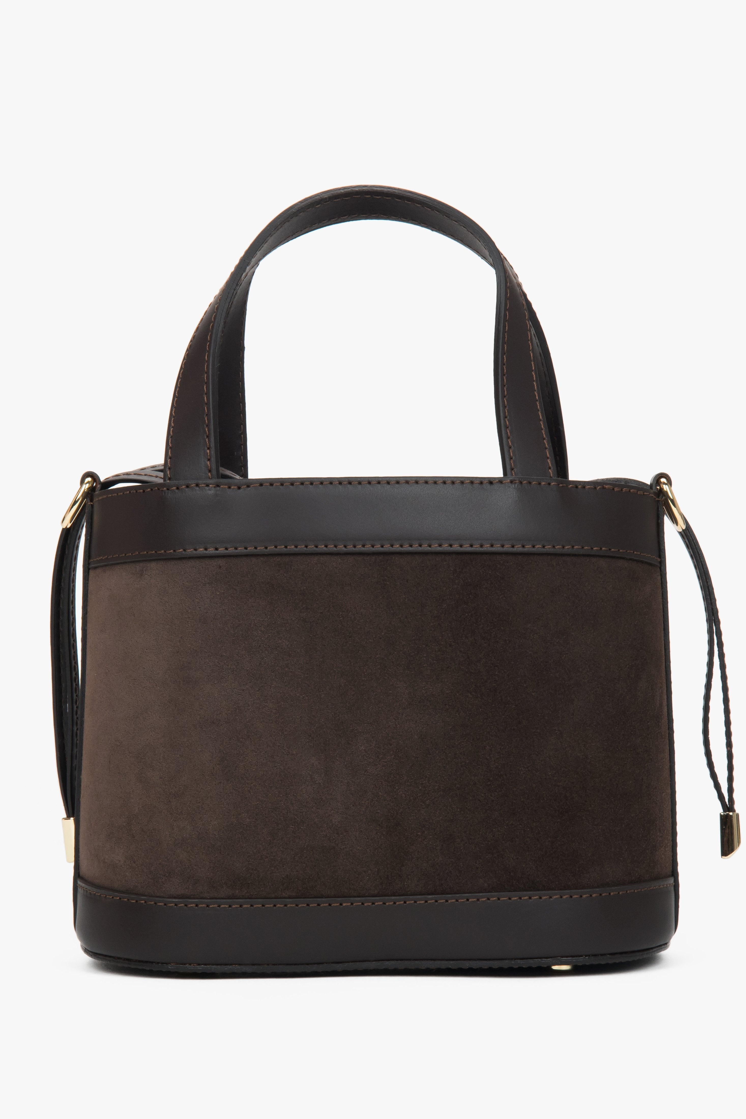 Seitenansicht der Tasche mit angebrachtem Trageriemen und goldener Hardware