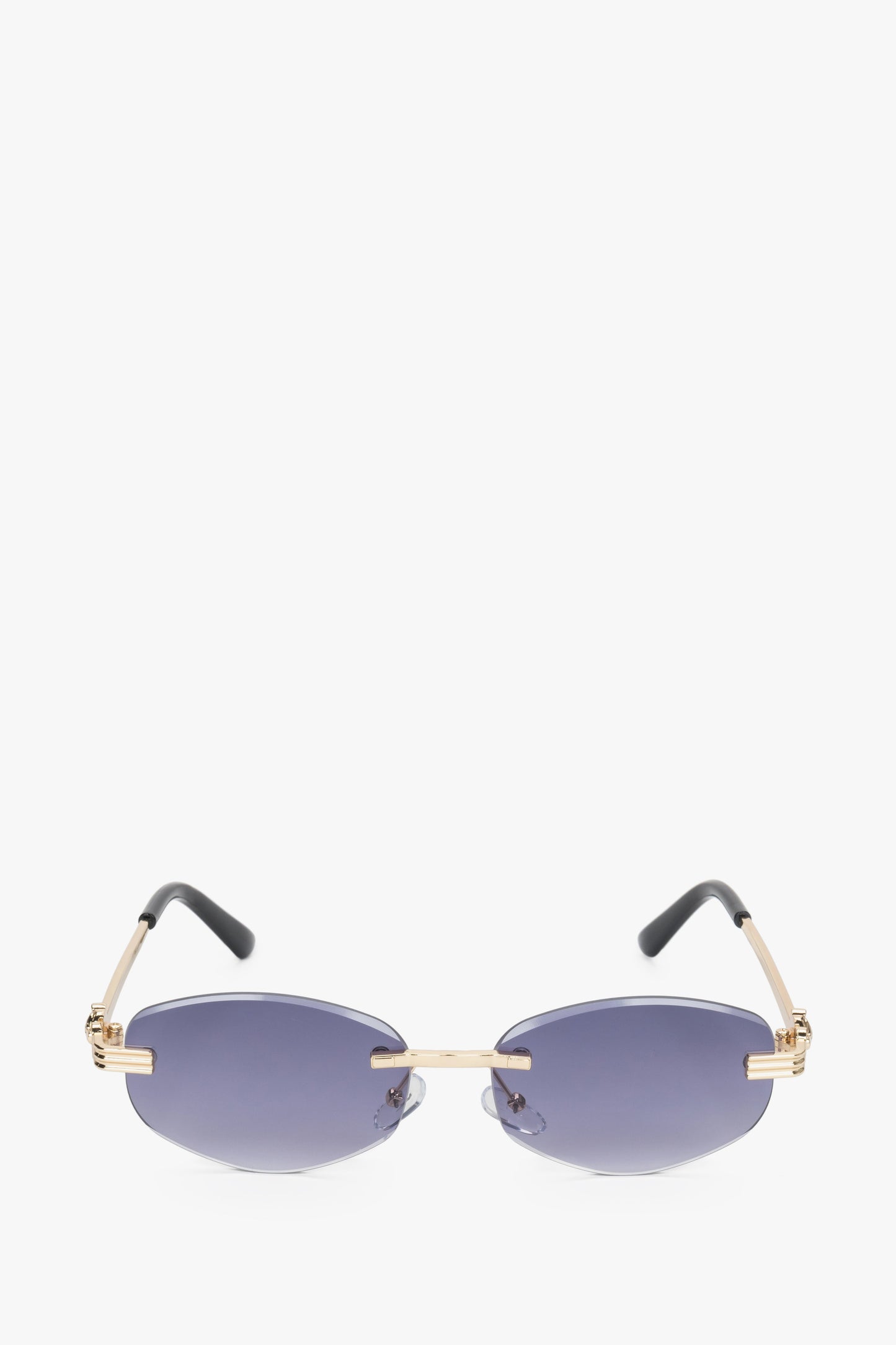 Frontansicht der grau-goldfarbenen ovalen rahmenlosen Damen-Sonnenbrille.