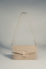 Hellbeige Damen-Handtasche aus Velours mit abnehmbarem Schulterriemen.