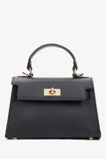 Frontale Ansicht der kleinen schwarzen Leder-Handtasche mit goldfarbenen Details