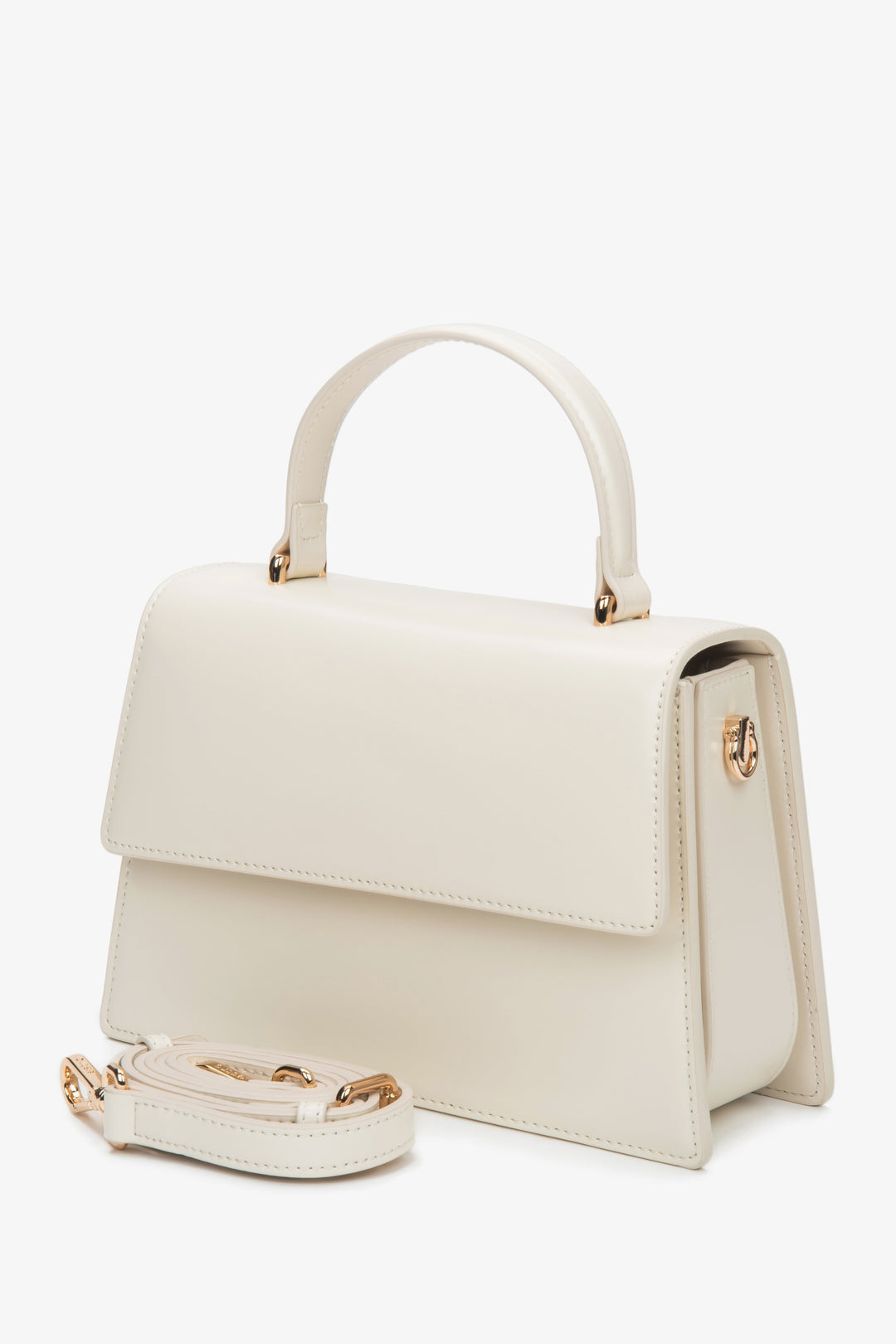 Elegante milchbeige Damenhandtasche mit zusätzlichem langem Schulterriemen.