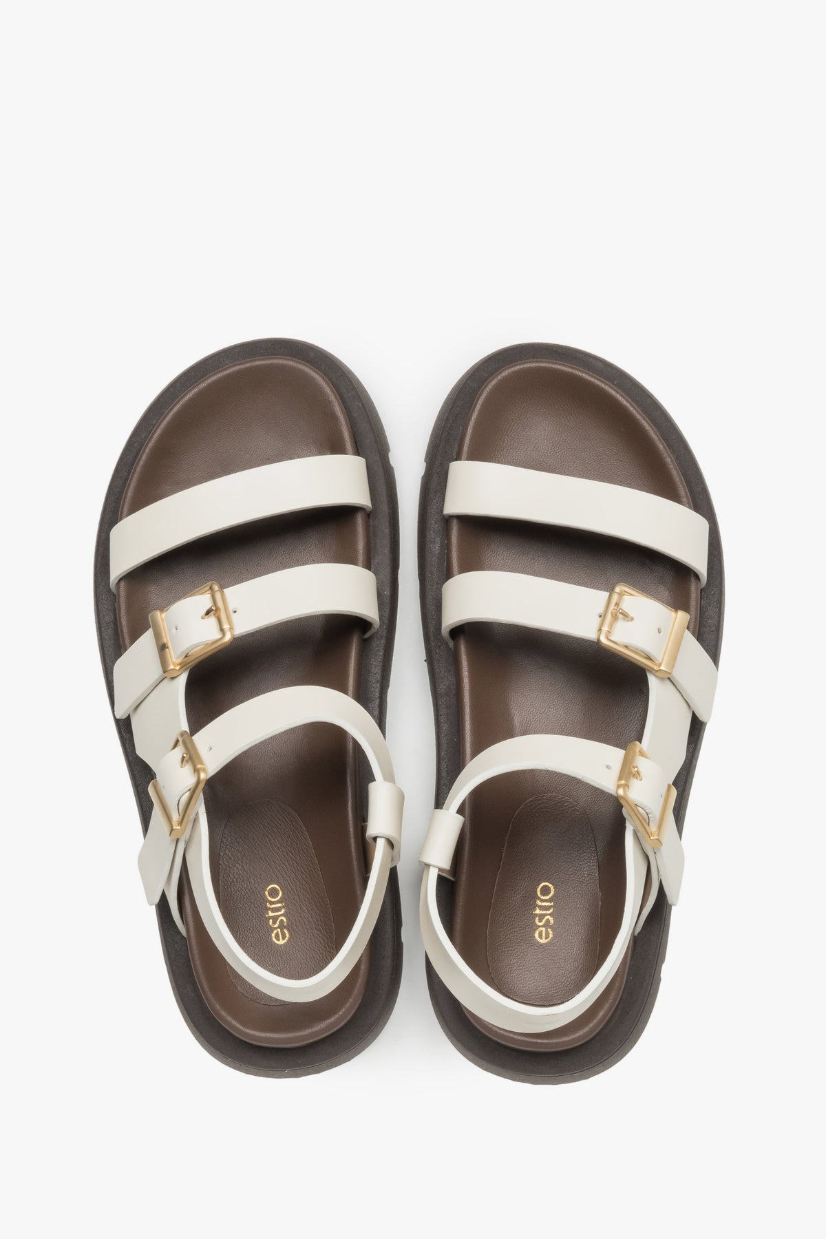 Milchbeige Damen-Sandalen aus Leder von oben als Paar mit dunkler Decksohle