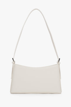 Milchbeige Damen-Schultertasche aus Leder in Frontansicht mit kurzem Riemen