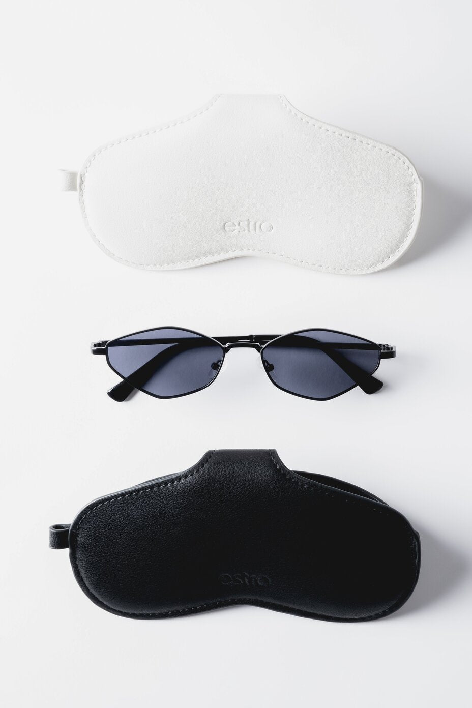 Milchweißes und schwarzes Brillenetui aus Echtleder mit Sonnenbrille 