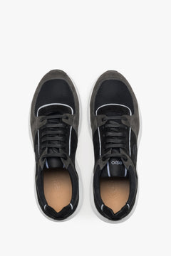 Symmetrische Draufsicht auf das Paar schwarz-grauer Premium-Sneaker