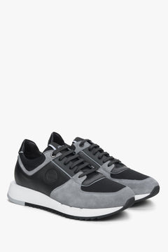 Frontalansicht der schwarz-grauen Herren-Sneakers aus Veloursleder mit flexibler Sohle