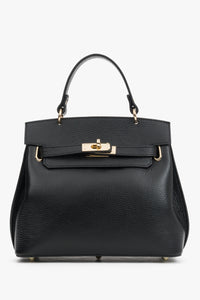 Frontale Ansicht der schwarzen Leder-Henkeltasche mit elegantem Goldverschluss und strukturiertem Finish 