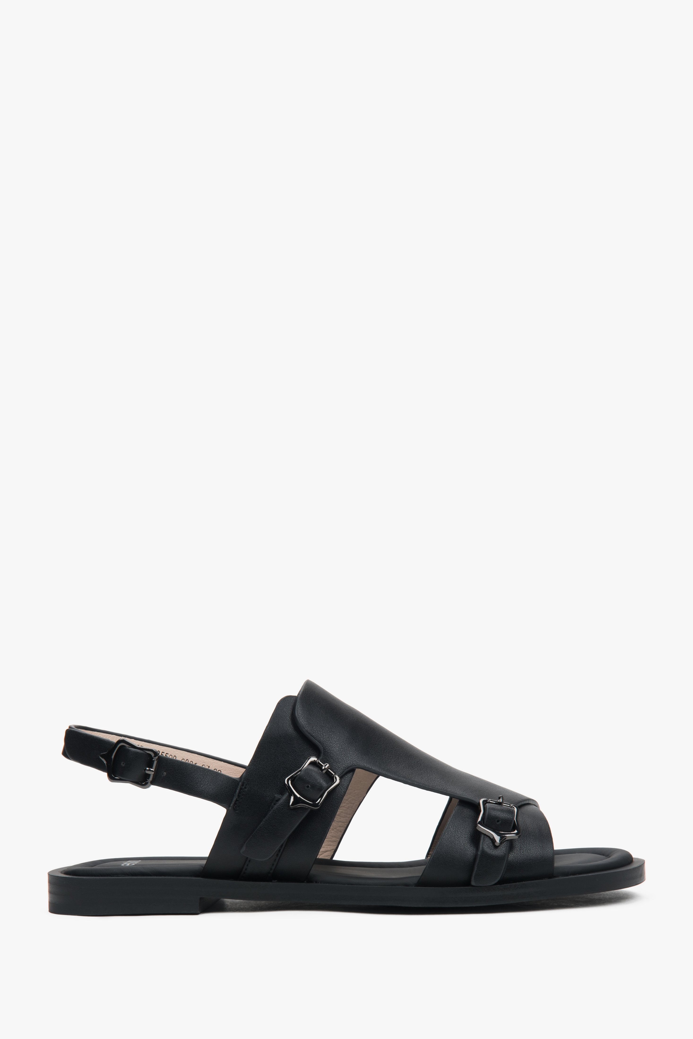 Profilansicht der schwarzen Leder-Sandalen mit flacher Sohle.