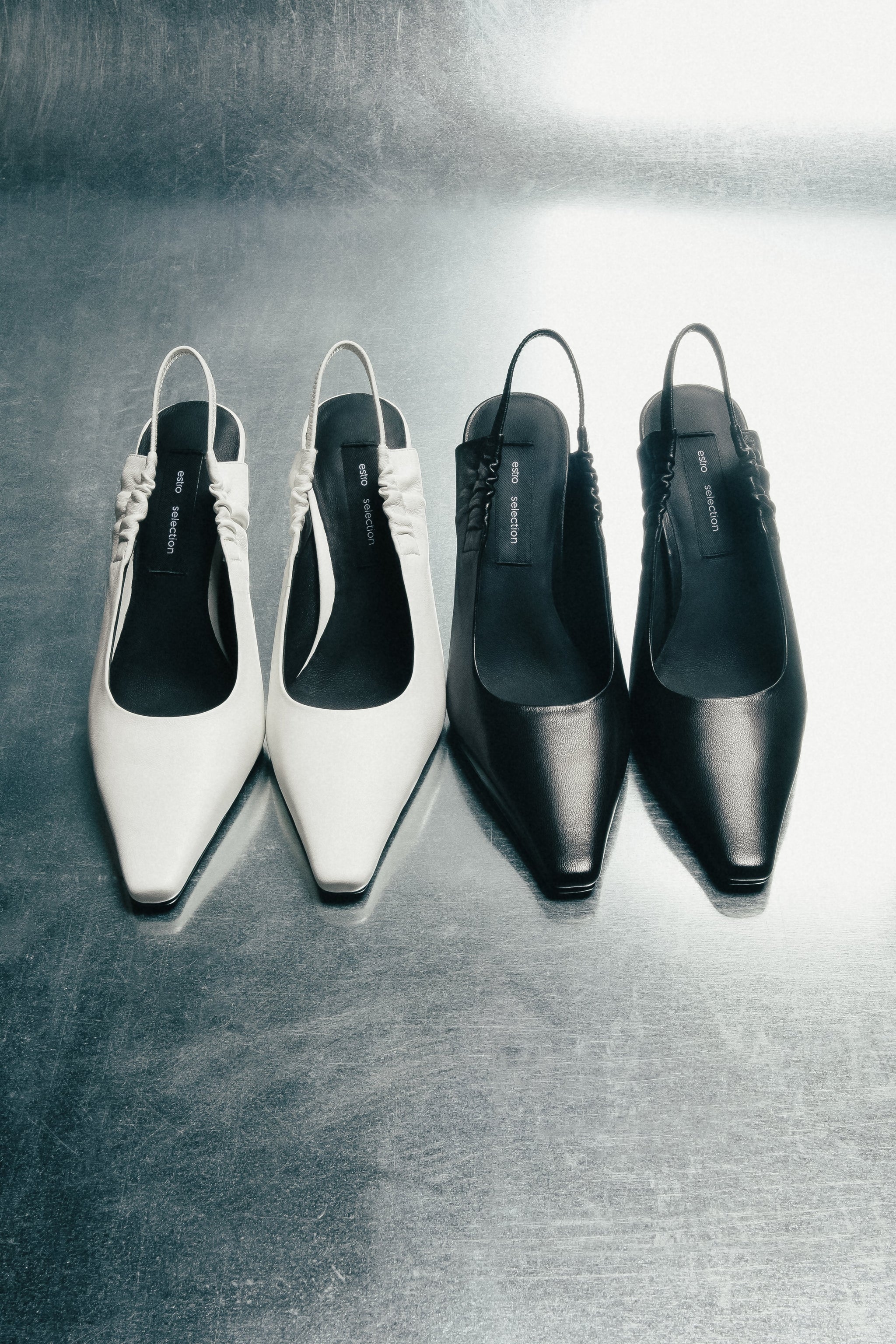 Elegante Paaransicht der schwarzen und hellen Pumps aus der Kollektion.