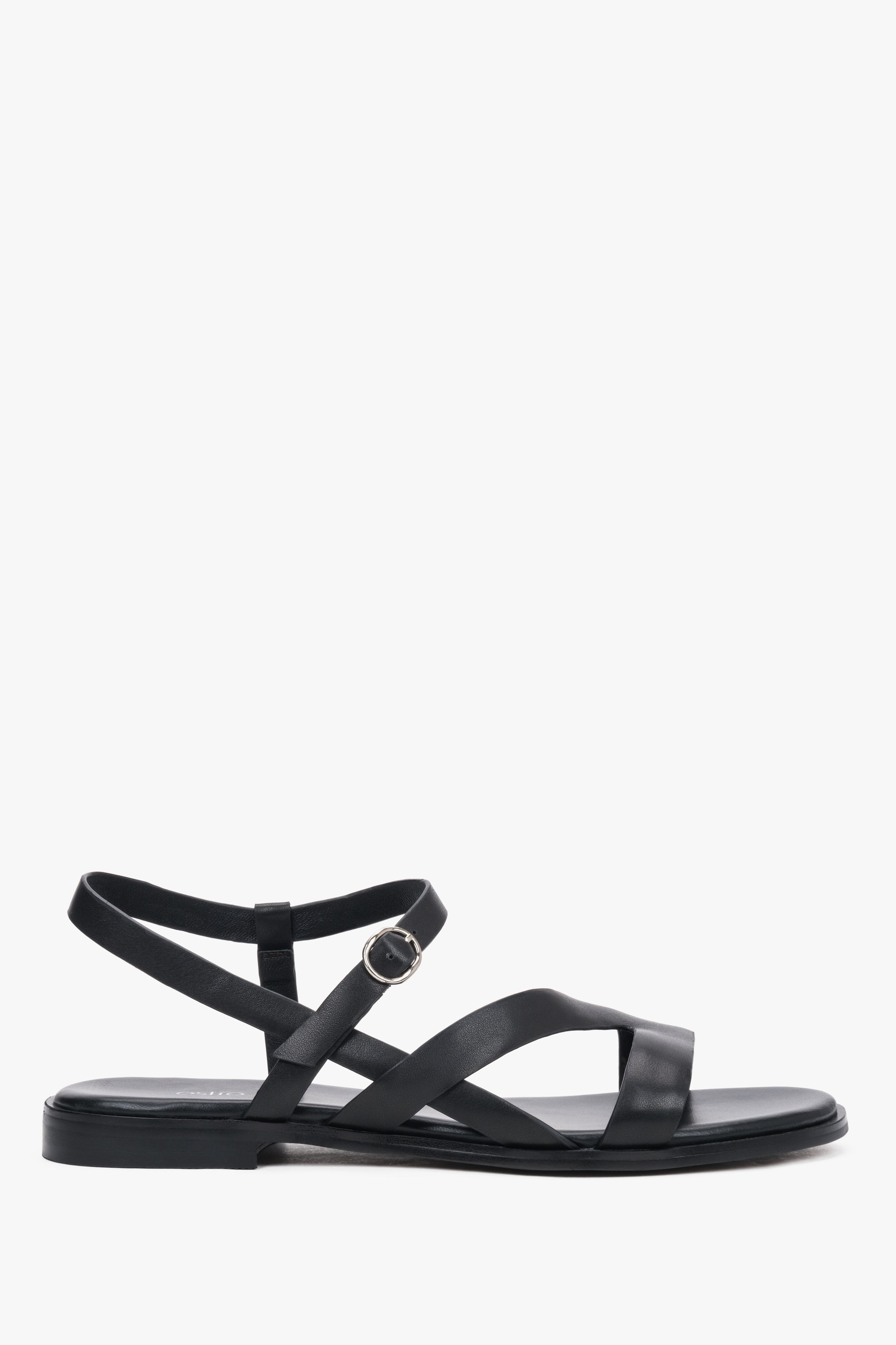 Schwarze flache Damen-Sandalen aus echtem Leder in seitlicher Profilansicht