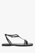 Schwarze flache Damen-Sandalen aus echtem Leder in seitlicher Profilansicht