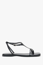 Schwarze flache Damen-Sandalen aus echtem Leder in seitlicher Profilansicht