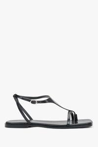 Schwarze flache Damen-Sandalen aus echtem Leder in seitlicher Profilansicht