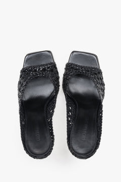 Paar schwarze Mules von Guglielmo Rotta von oben