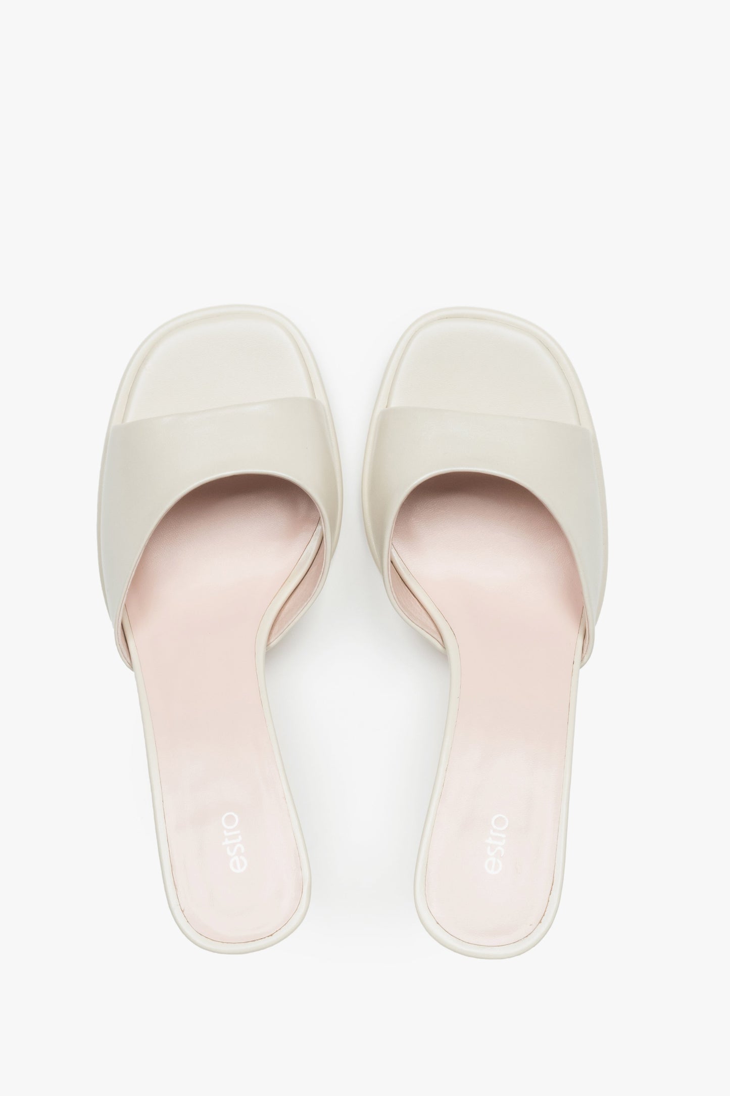 Exklusive Damen-Mules aus weißem Naturleder für einen luxuriösen Sommer-Look.